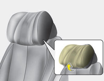 Kia Carnival: Headrest (for rear seat). The headrest may be adjusted forward or backward by pulling the lower part of