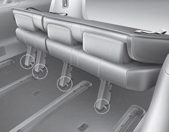Kia Carnival: Rear seat adjustment. 3. Make sure the catches are locked in position by moving the seat forward and