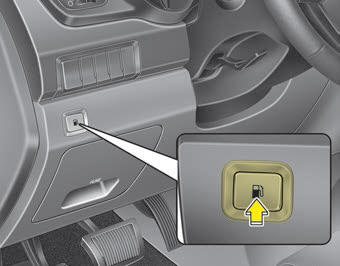 Kia Carnival: Opening the fuel filler lid. The fuel filler lid must be opened from inside the vehicle by pulling up the