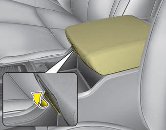 Kia Carnival: Center console storage. To open the center console storage, pull up the lever.